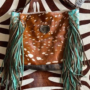 Keep it Gypsy Rosie bag. Turquoise tooled, axis hyde, with fringe.